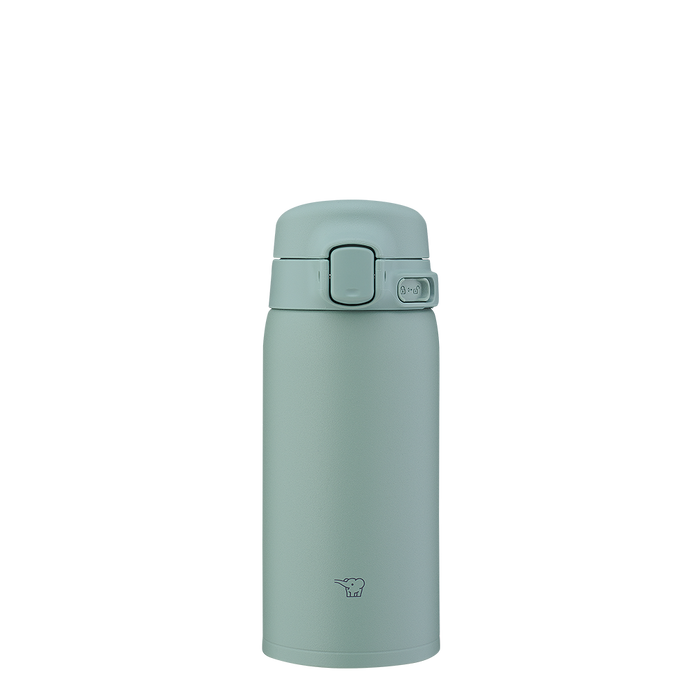 Green thermos bottle on a white background