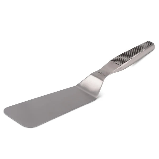 A stainless steel spatula with an offset handle featuring a dimpled grip on white background.