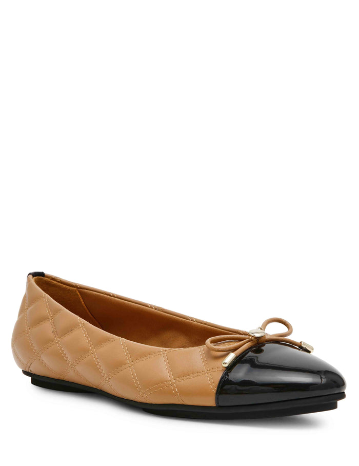 Anne Klein Luci Quilted Ballet Flat in camel with black patent cap toe, bow detail, and diamond quilt upper