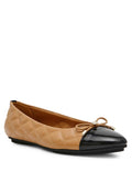 Anne Klein Luci Quilted Ballet Flat in camel with black patent cap toe, bow detail, and diamond quilt upper