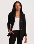 Black petite peak lapel blazer with silver-tone faux double-breasted buttons, worn open over a white tee and black trousers.