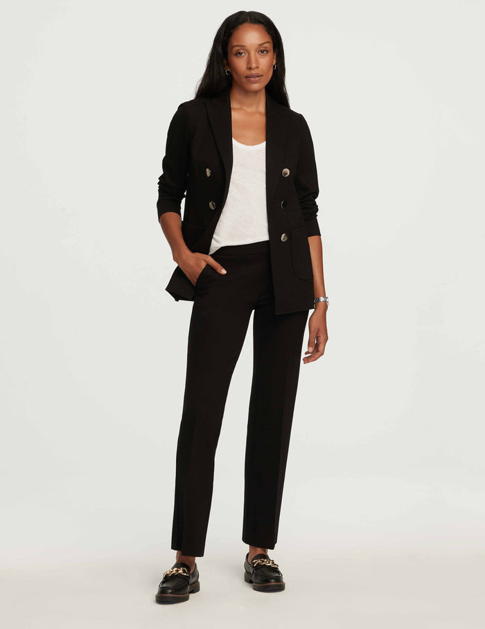 Petite black double-breasted blazer with gold buttons and peak lapels, styled with matching black trousers and white tank