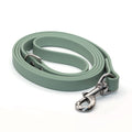 Sage green biothane dog leash with stainless steel hardware on a white background